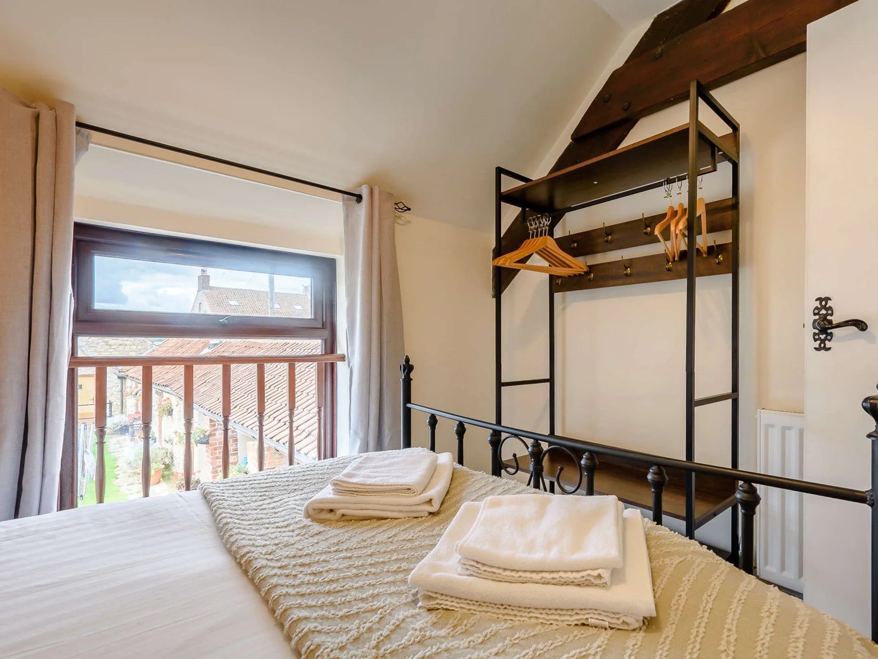 Bedroom with Juliet-style opening and courtyard outlook