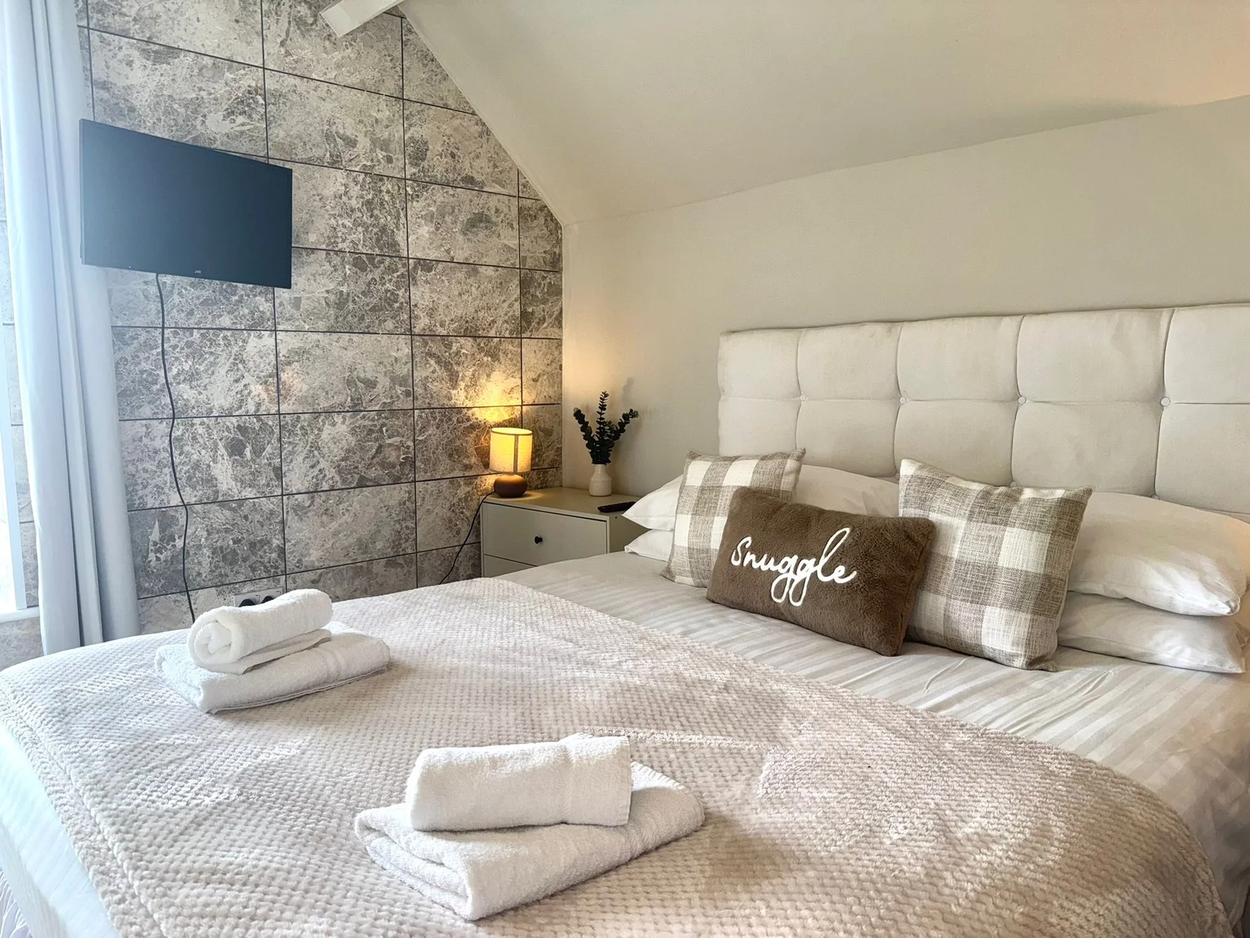 Softly styled double bedroom