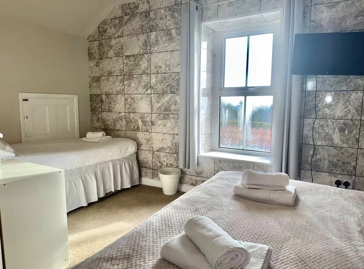 Family bedroom with three beds