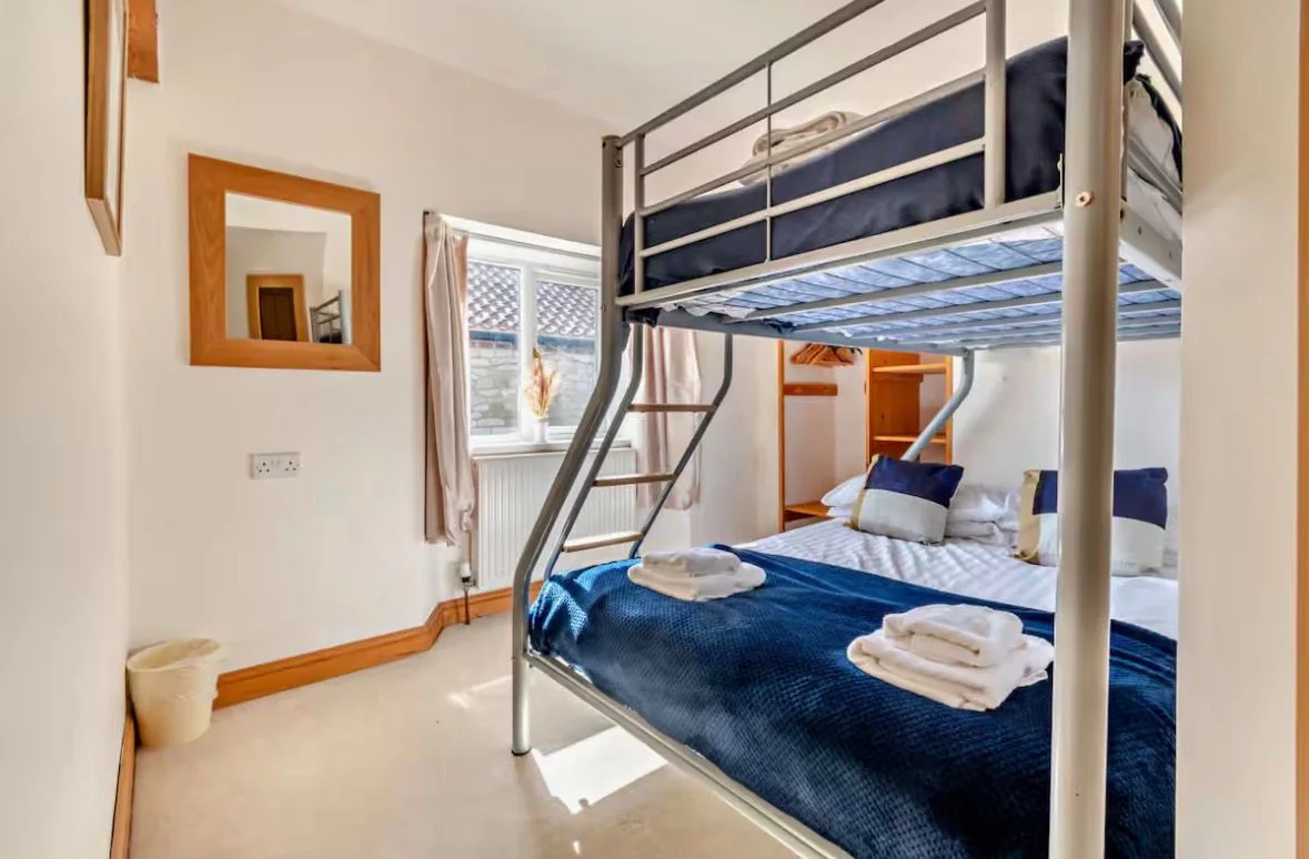 Family bunk room with double below and single above